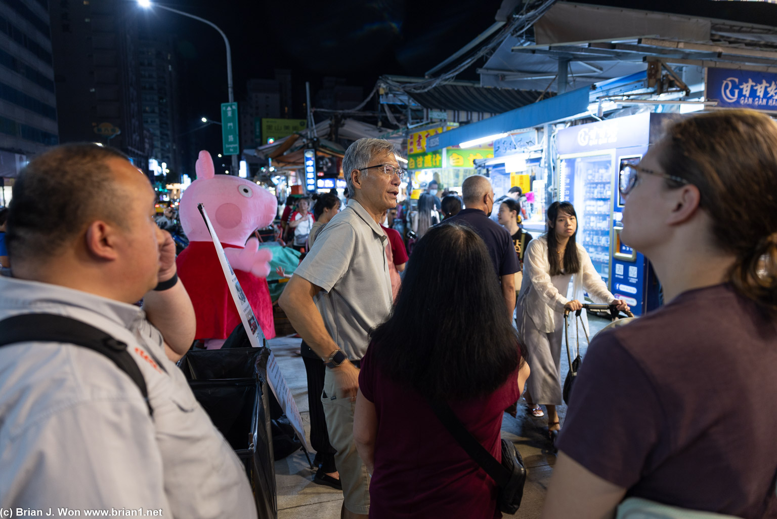 Inaugural flight passengers being lead around Ruifeng Night Market by Po-Jen.