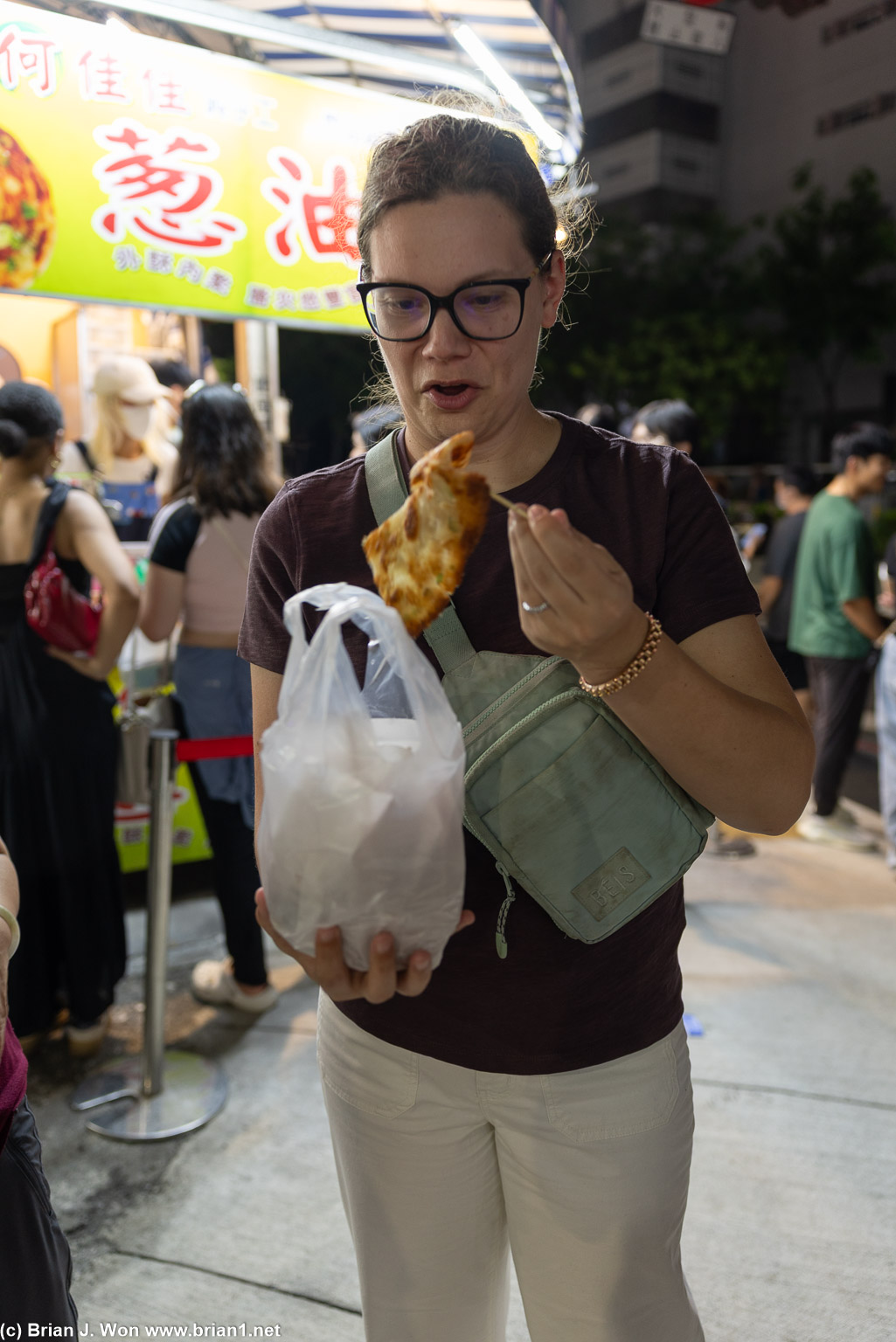Jenny is very excited by her massive green onion pancake.