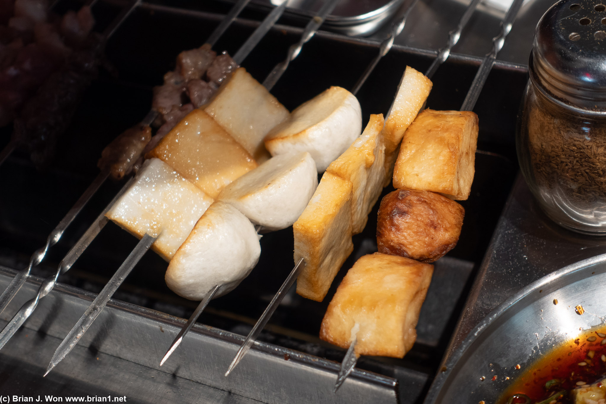 Fish tofu and fish balls on the grill, and I think that's a potato?