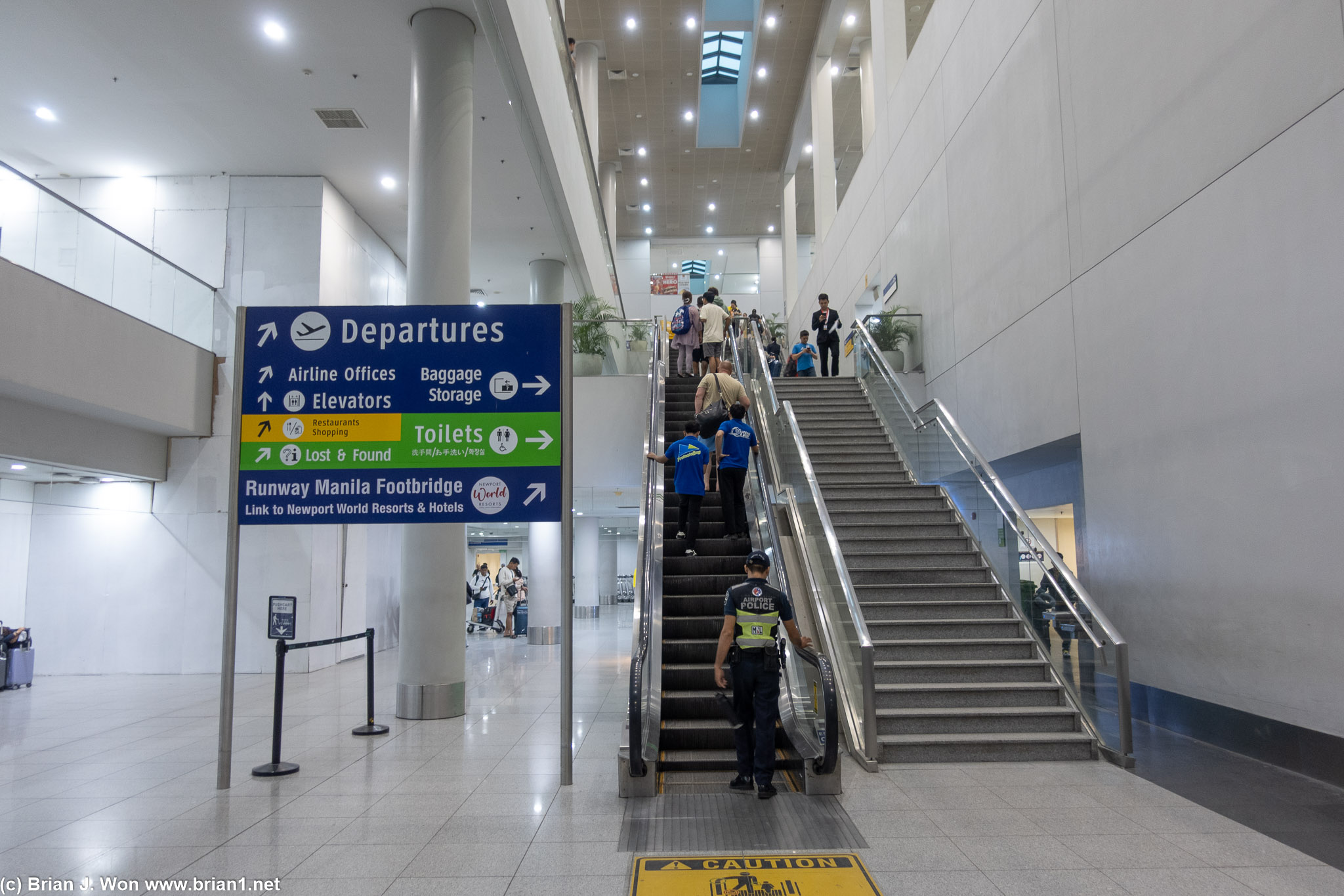 Follow the signs to the Runway Manila Footbridge to Newport World Resorts and Hotels.