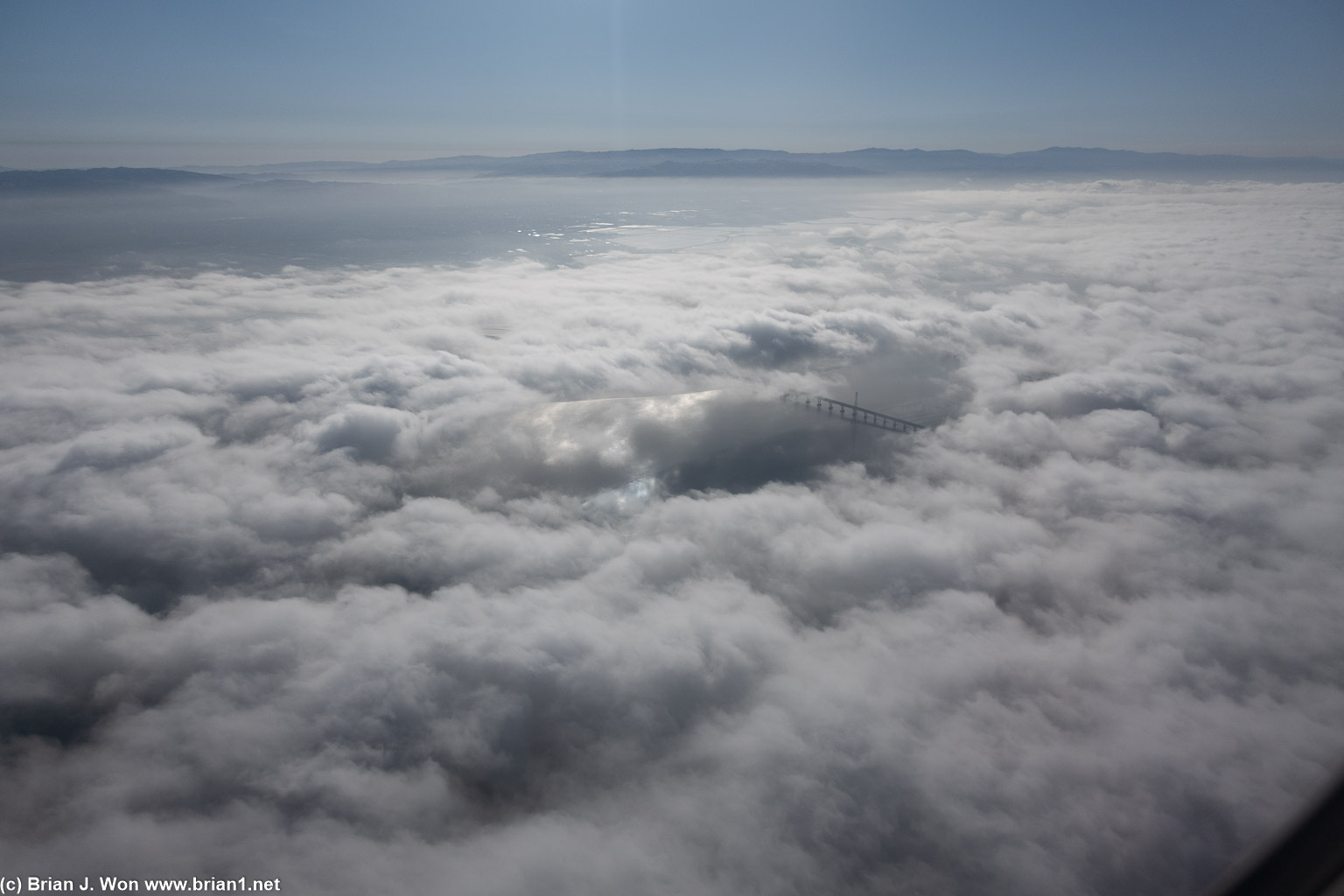 The Dumbarton Bridge peeking through the fog.