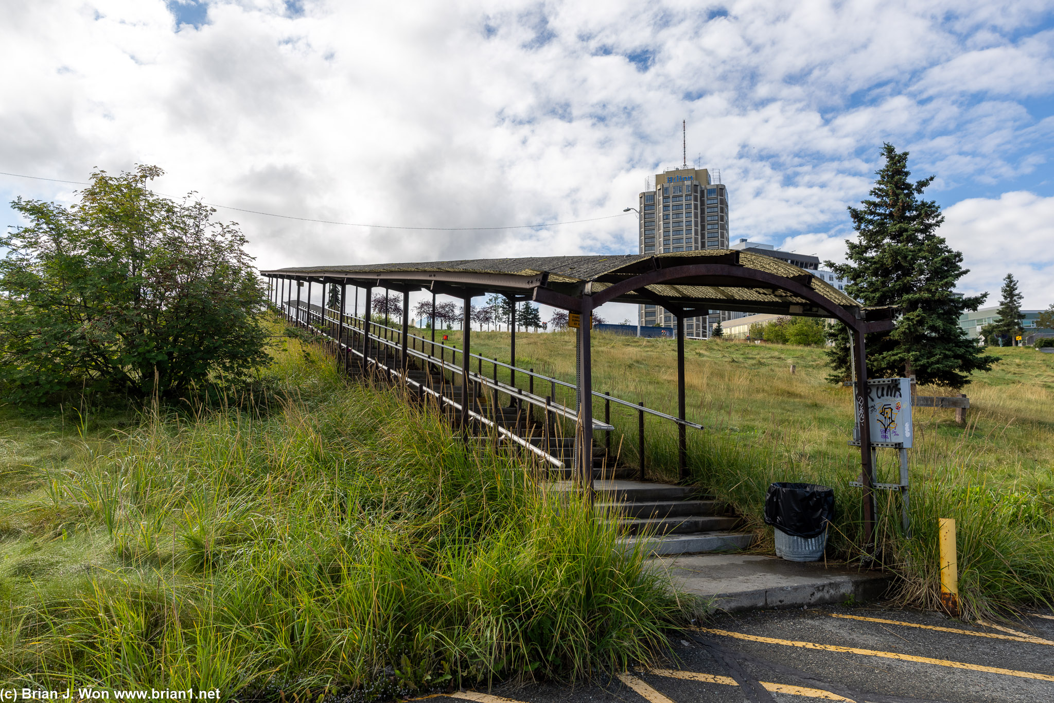 Two sets of outdoor covered stairs called "Salmon Run."
