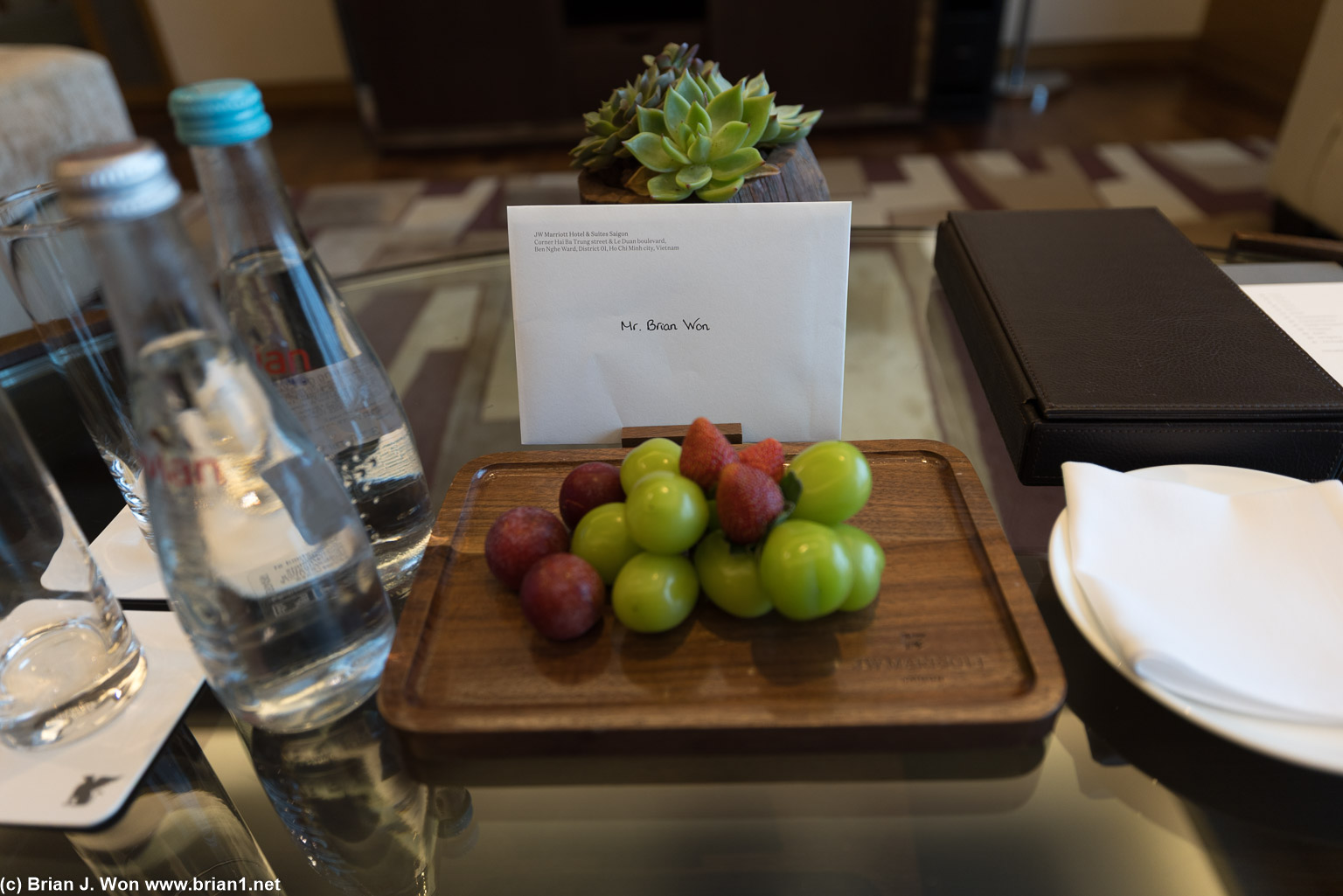Welcome note, water, and fruit.