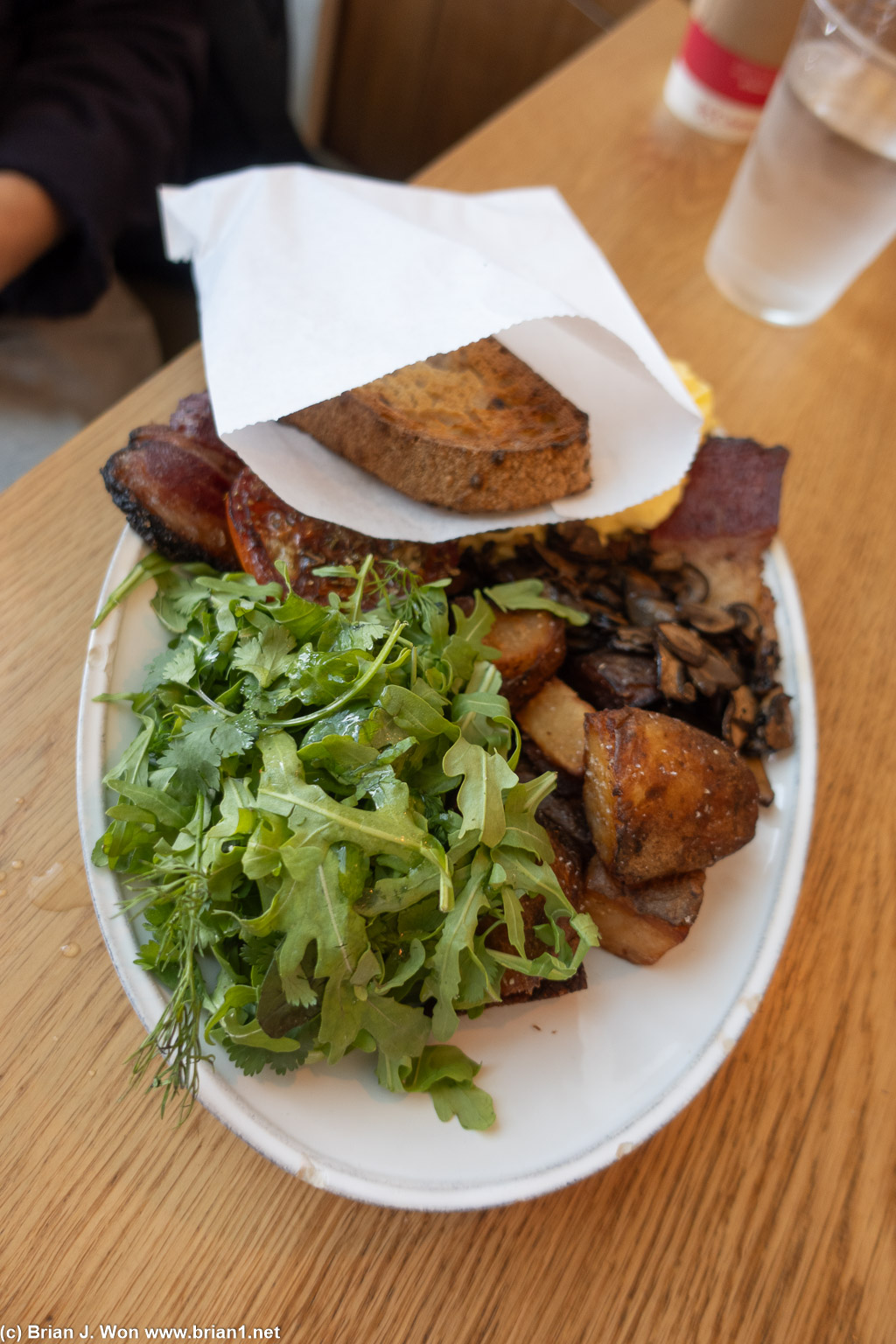 Vicky's Breakfast: scrambled eggs, pastrami, mushrooms, tomato, potato, toast, arugula.