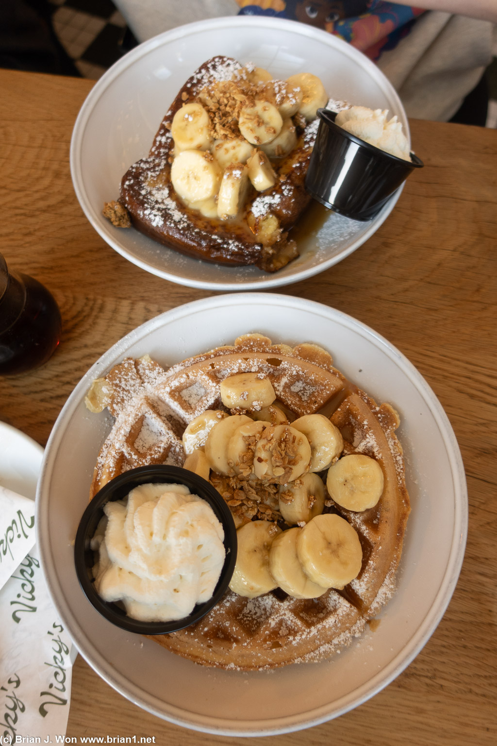 Bananas foster topping on both waffle and french toast.