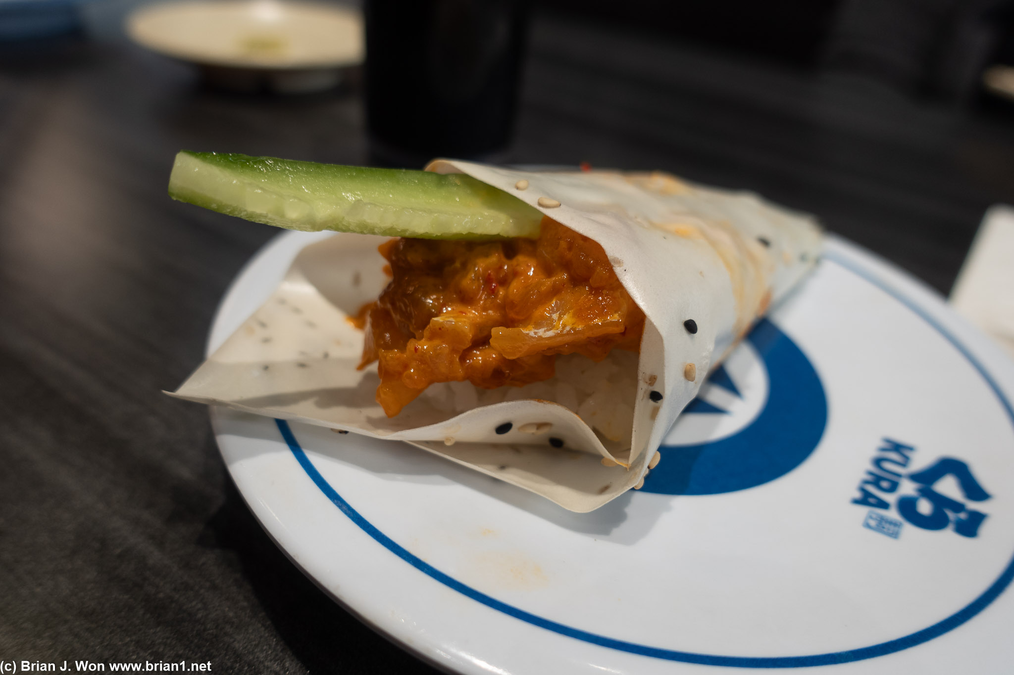 Spicy yellowtail hand roll in soy paper was meh.