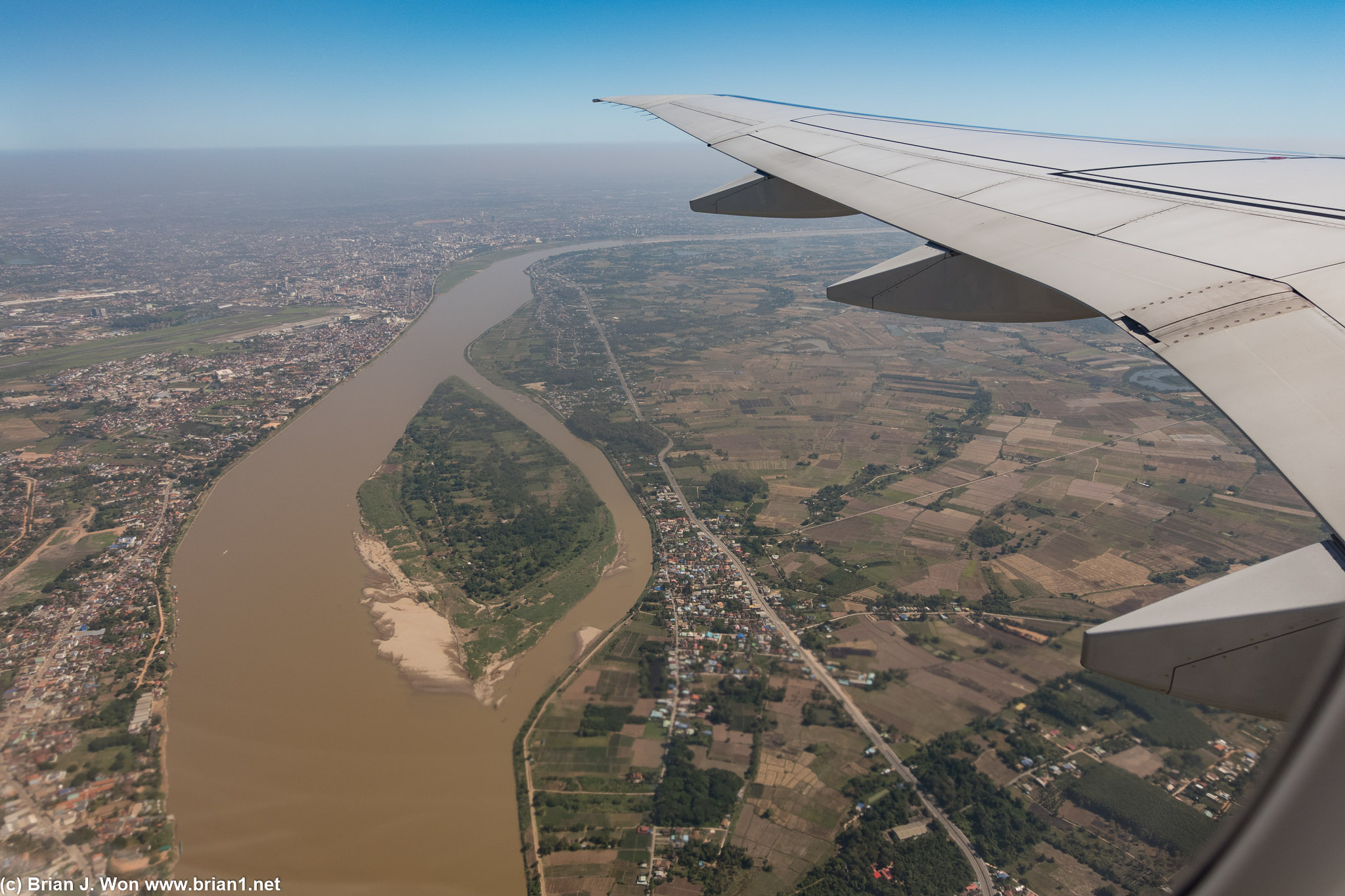 Vientiane's downtown visible to the left.