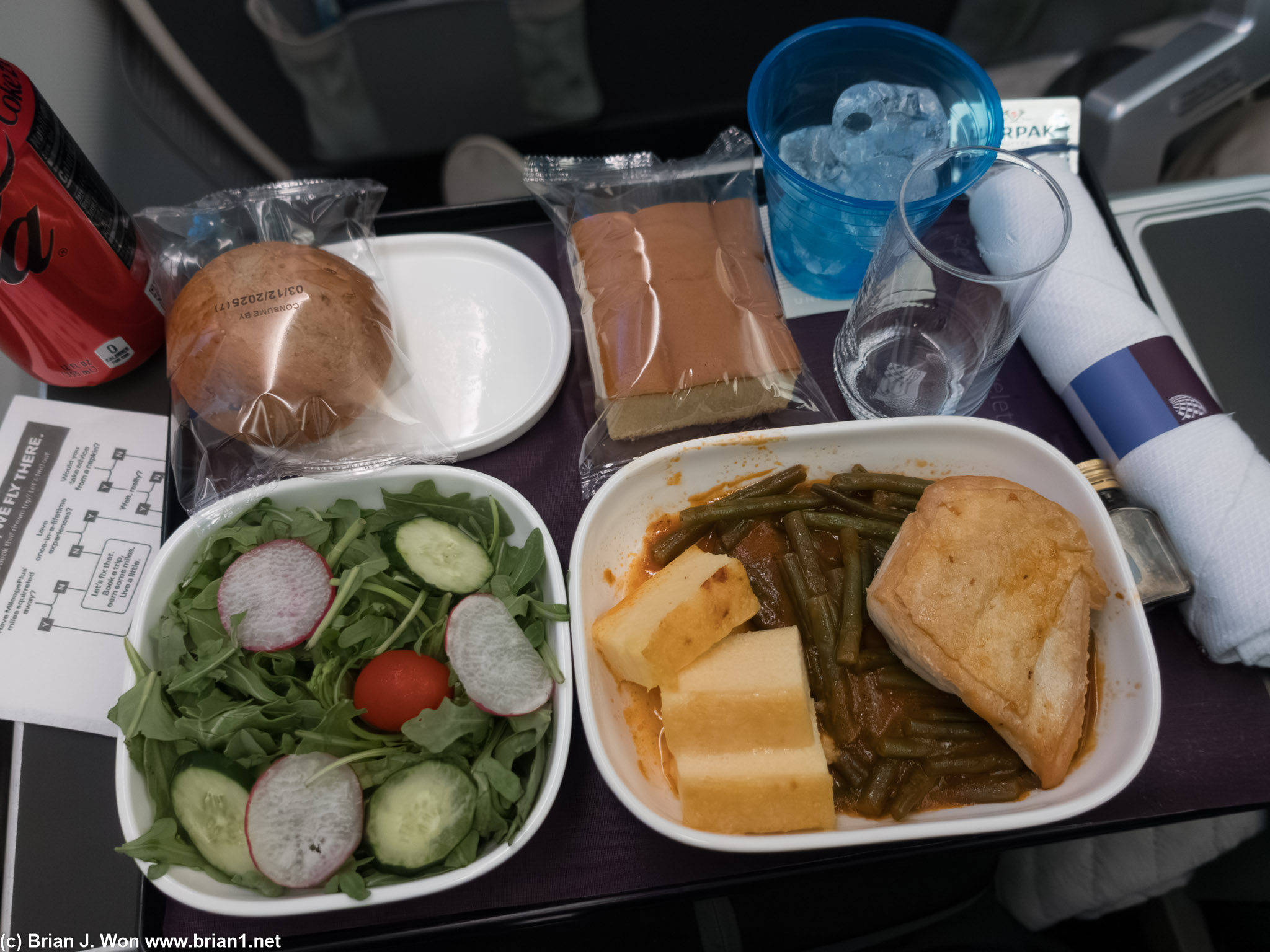 Dinner in Premium Plus. Polenta cakes and chicken breast.